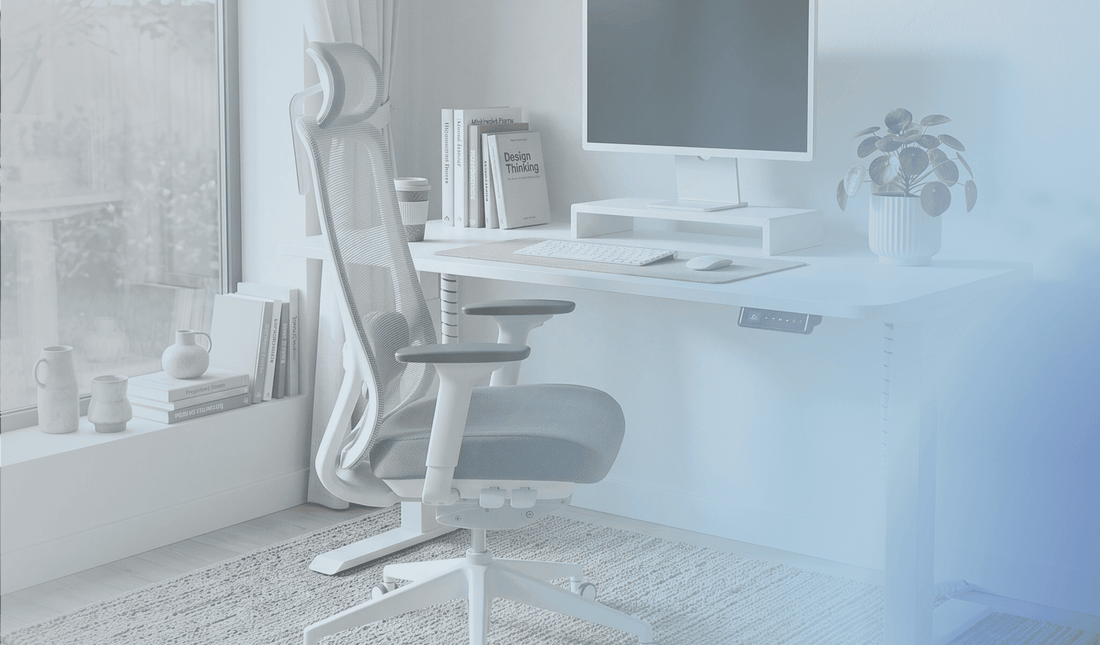 ergonomic home office setup with a height adjustable standing desk and ergonomic chair