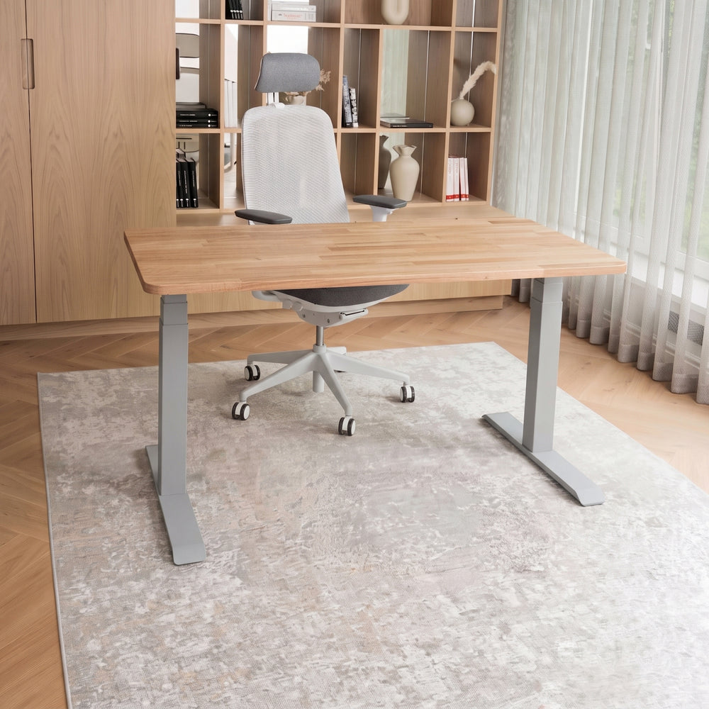 Solid oak desk with white legs on a white background