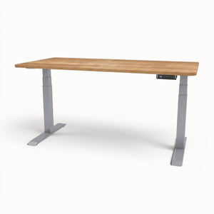 Solid oak desk with adjustable height on a white background