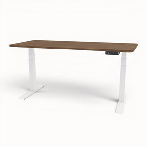 Walnut standing desk with white legs on a white background