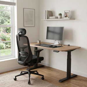 Home office setup with a adjustable desk, chair, and computer monitor.