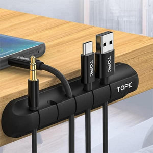 Cable organizer on a wooden surface.