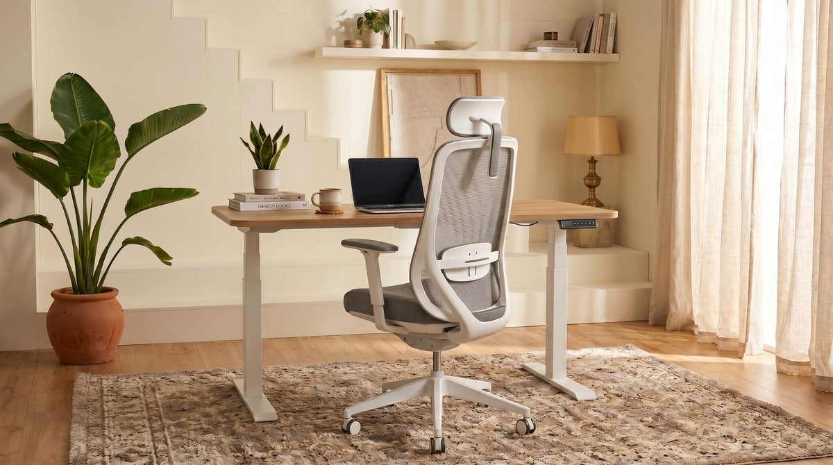 Modern office chair in a home office setting with a stand-up desk and decor.