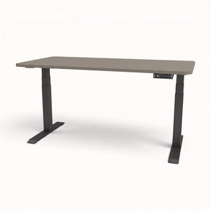 An adjustable height standing desk with a gray wood-grain top and black metal legs, shown on a clean white background.