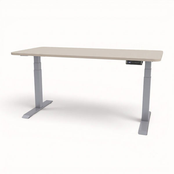 An adjustable height standing desk with a light beige wood-grain top and gray metal legs, shown on a clean white background.